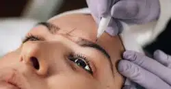 Close-up of Beautician Doing Permanent Brow Tattoo
